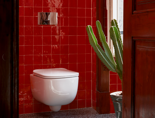 Handmade Moroccan Zellige tiles in high gloss deep red glaze installed on bathroom wall in 4x4 inches 2x2 inches 10x10 cm and 5x5 cm sizes