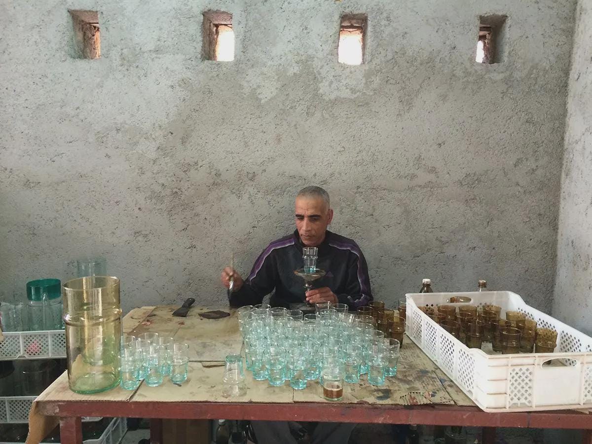 Artisan crafting Moroccan Beldi drinking glasses on a wooden table in a workshop, House of Anouar