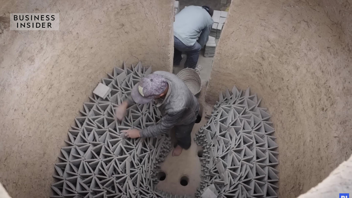 Artisans arranging handmade Moroccan Zellige clay tiles in a traditional kiln, House of Anouar