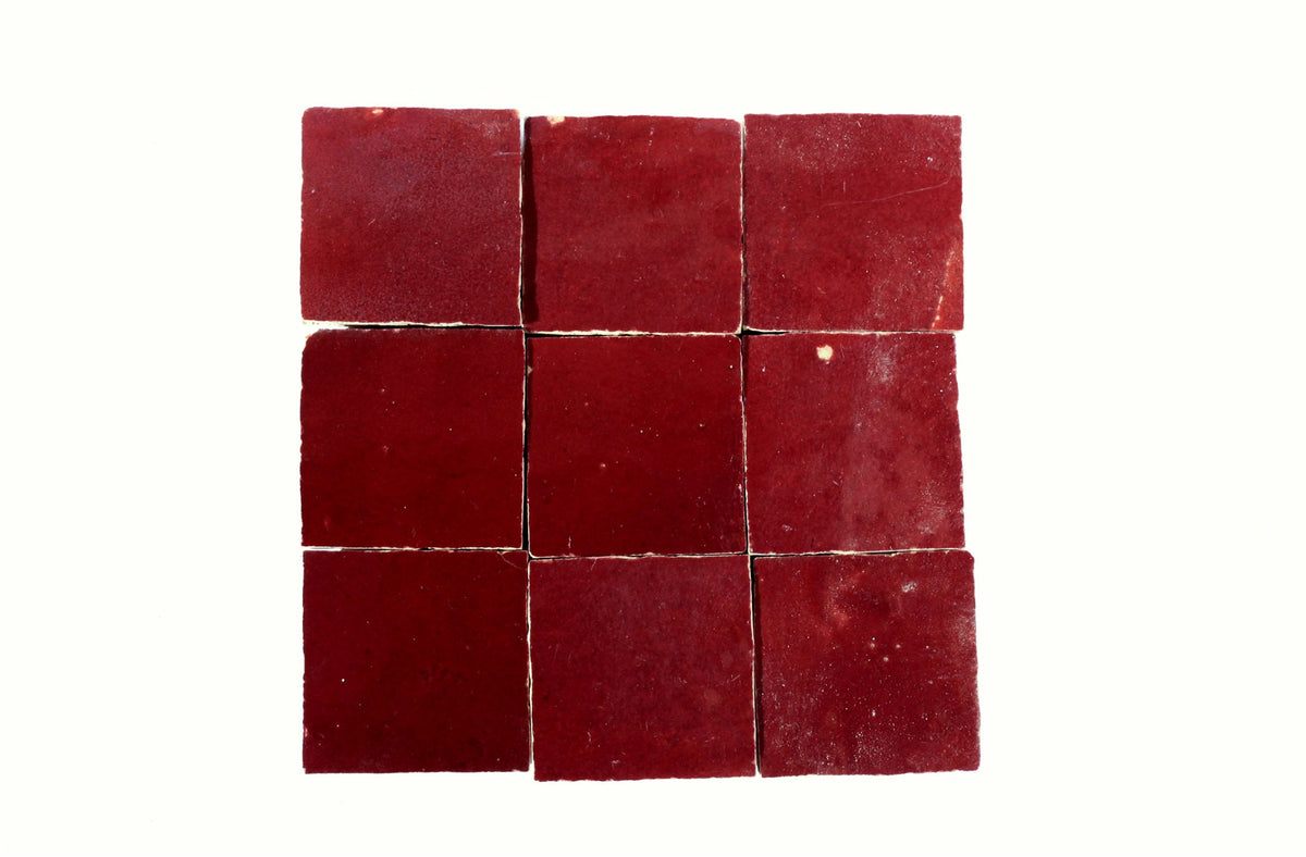 Burgundy-red square Moroccan zellige tiles arranged in a grid, House of Anouar