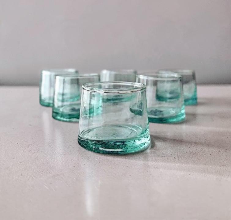 Clear short Beldi glasses arranged on a tabletop, House of Anouar