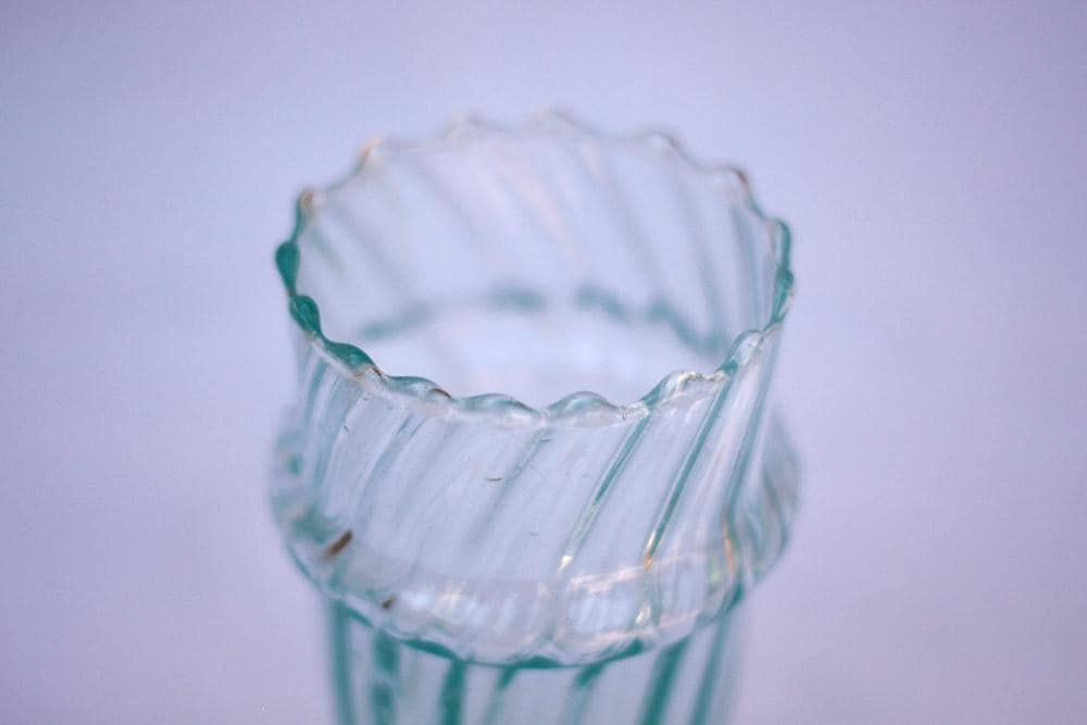 Close-up of the scalloped rim of a clear fluted Beldi glass, House of Anouar