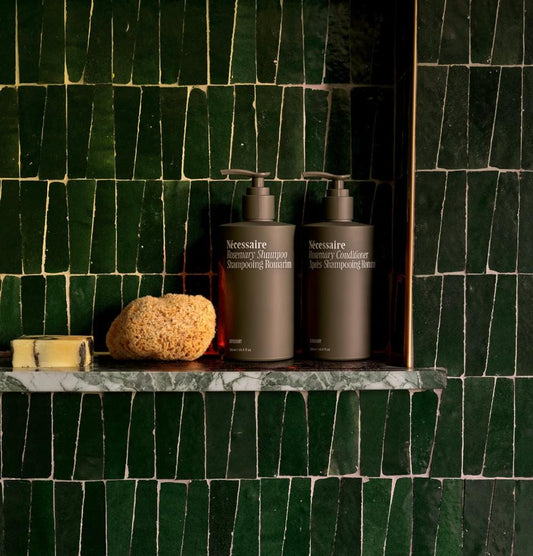 Dark-green trapezoid zellige tiles around a bathroom shelf, House of Anouar