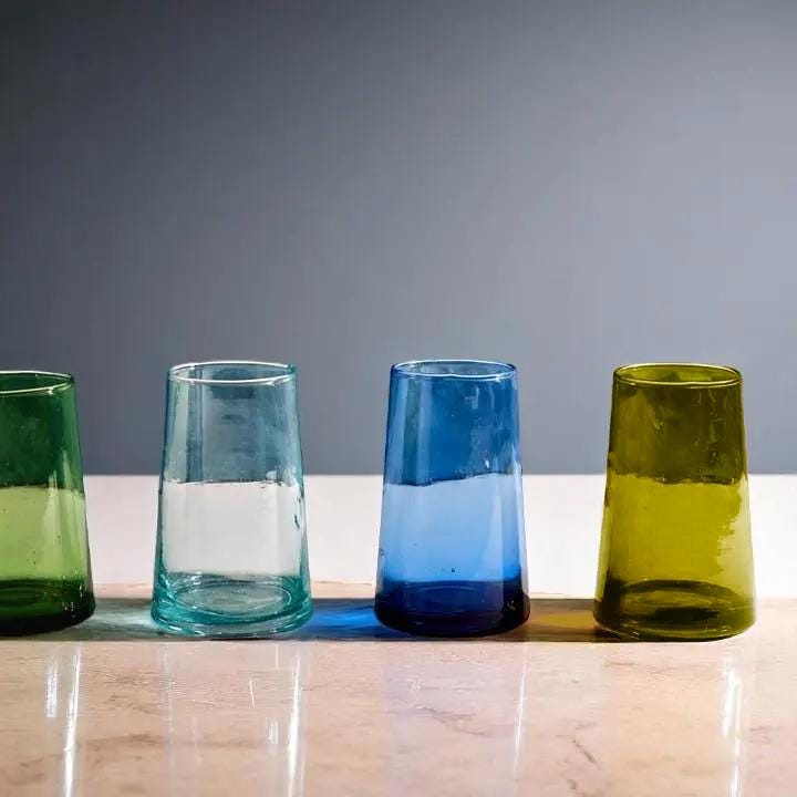 Four colorful Moroccan Beldi drinking glasses in green, light blue, blue, and olive yellow, House of Anouar