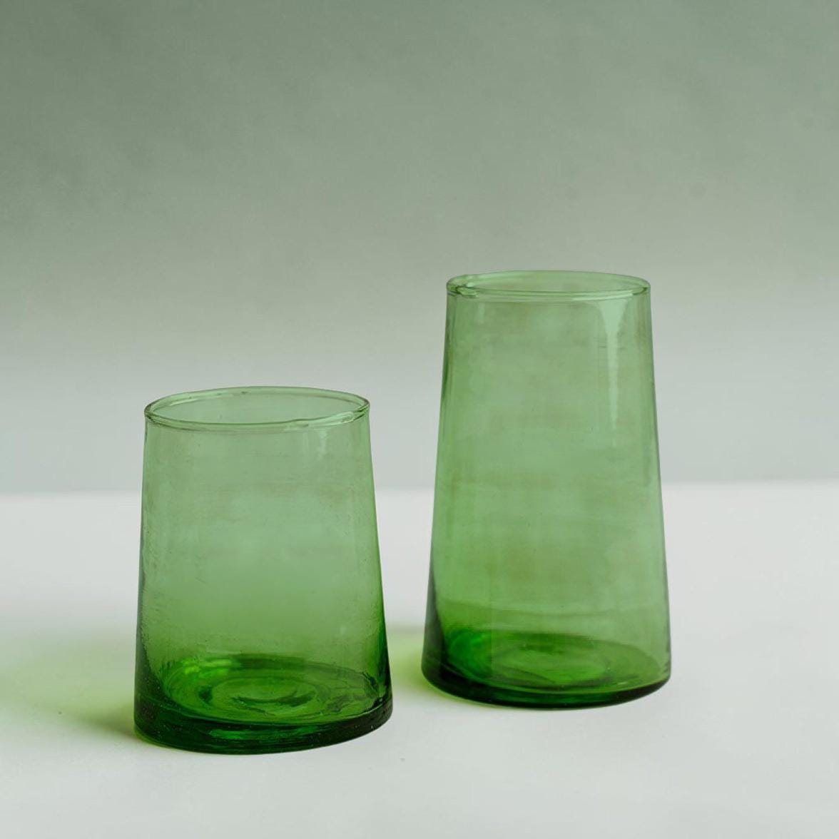 Green Beldi glasses in short and tall sizes on a pale background, House of Anouar
