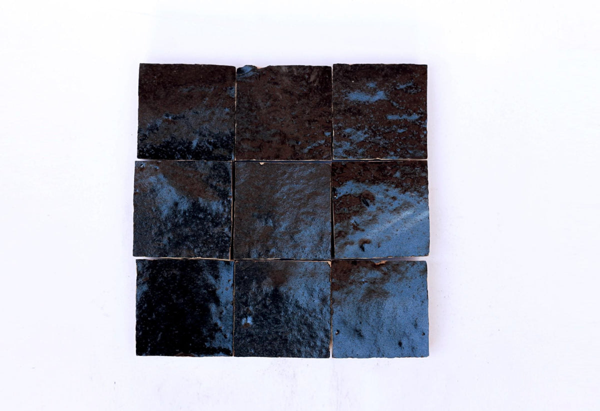 Handmade dark blue Moroccan Zellige tiles with a glossy, textured finish, House of Anouar