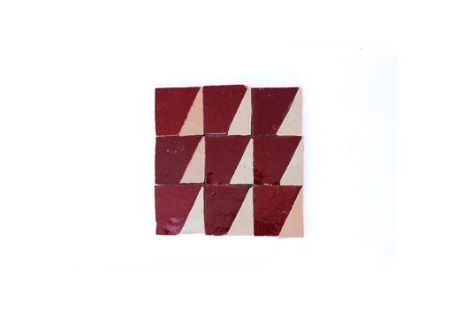 Handmade Moroccan Zellige tile in triangle geometric mosaic pattern in a deep burgundy red glaze and cream colored unique zellige tile