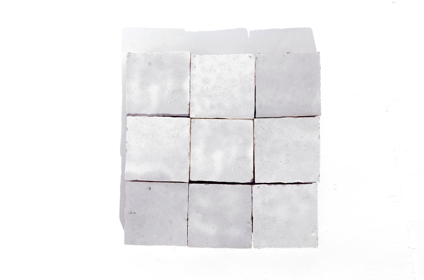 Handmade white Moroccan Zellige tiles in 4x4 inches 2x2 inches 10x10 cm and 5x5 cm square sizes with glossy finish and natural variation
