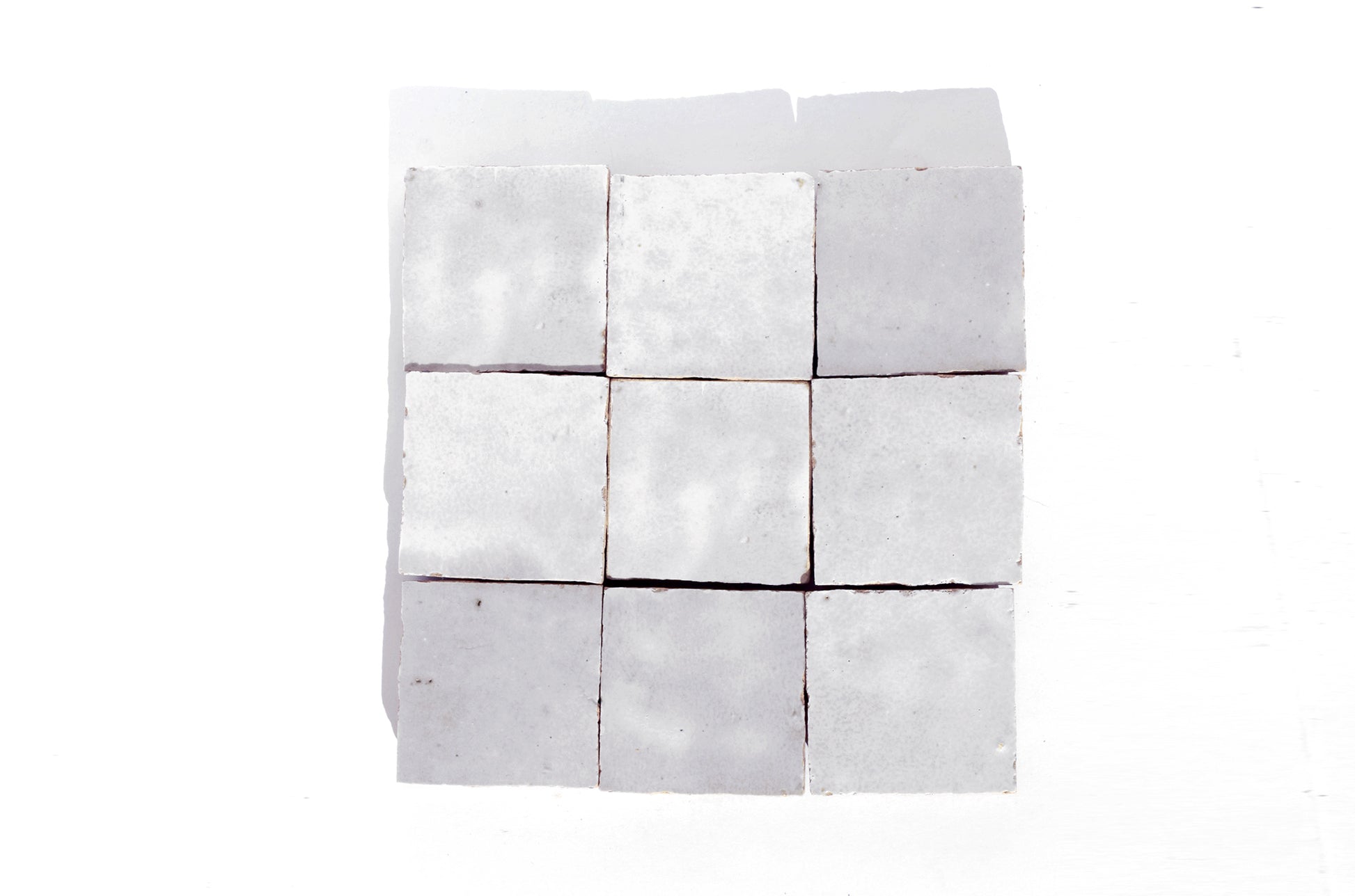 Handmade white Moroccan Zellige tiles in 4x4 inches 2x2 inches 10x10 cm and 5x5 cm square sizes with glossy finish and natural variation