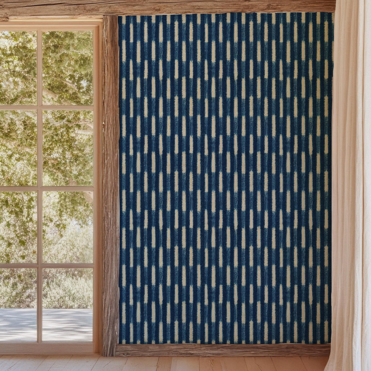 Indigo Baule strip-weave wallpaper beside a garden doorway, House of Anouar