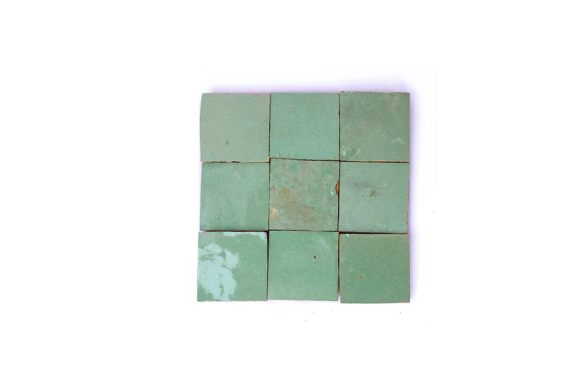 Light-green square Moroccan zellige tiles arranged in a grid, House of Anouar