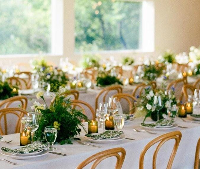 Olive-green Beldi glasses and flowers on a wedding table, House of Anouar