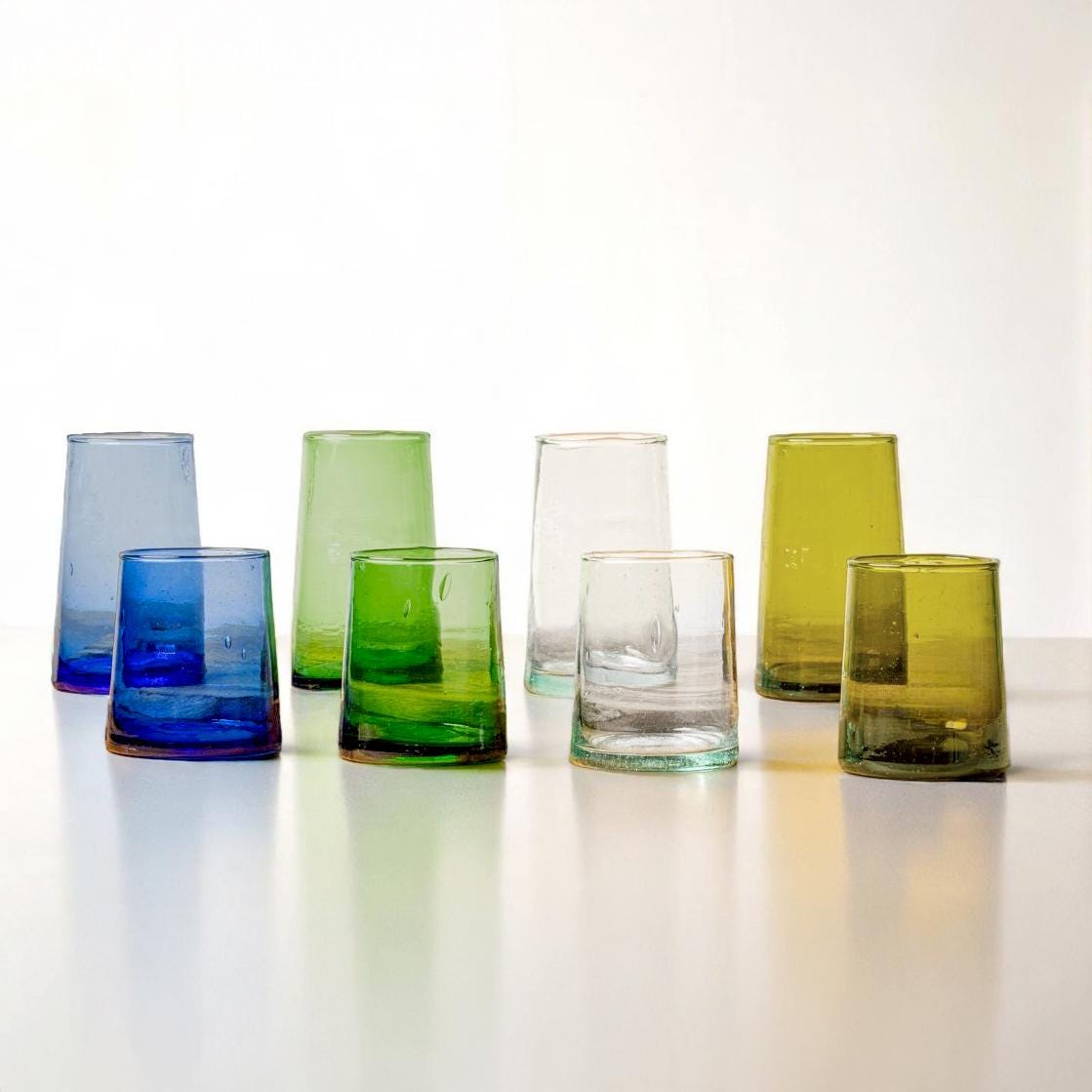 Set of colorful handmade Moroccan Beldi drinking glasses in blue, green, clear, and olive, House of Anouar