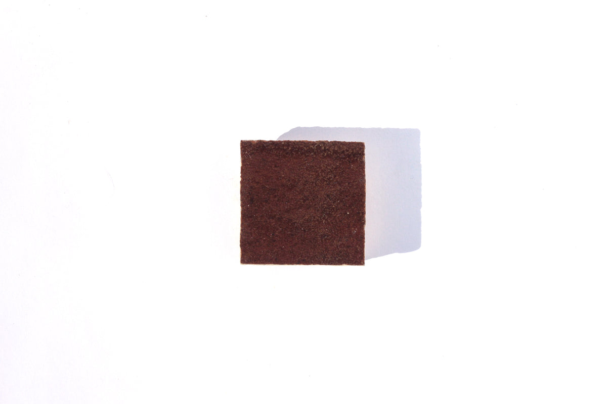 Single brown handmade Moroccan Zellige tile by House of Anouar on a white background