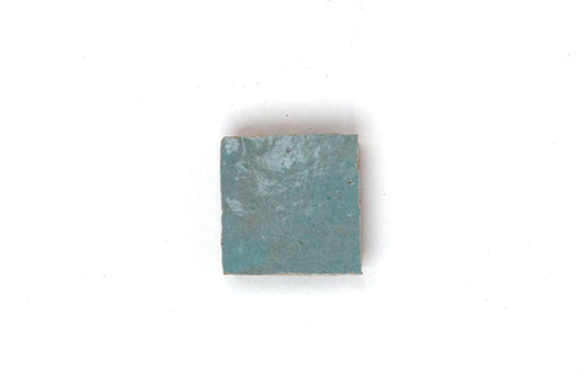 Single handmade light blue House of Anouar Zellige tile on a white background