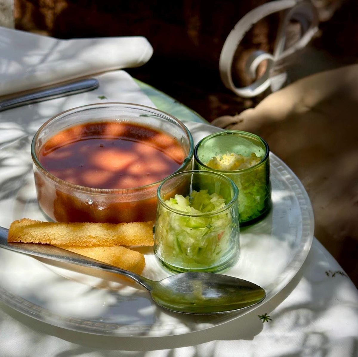 Tea glasses on a silver tray beside a Moroccan teapot, House of Anouar