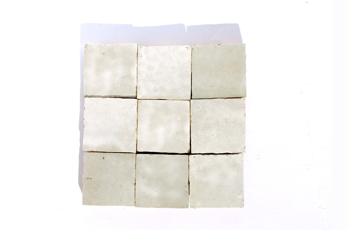 White square Moroccan zellige tiles arranged in a grid, House of Anouar